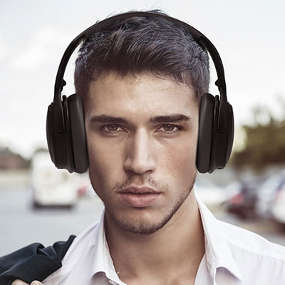 man-wearing-TaoTronics-Active-Noise-Cancelling-Bluetooth-Headphones