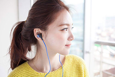 woman-wearing-Sony-MDRXB50AP-Extra-Bass-Earbud-Headset